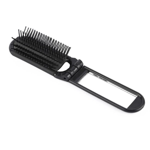 Portable folding hairbrush with integrated vanity mirror in black compact plastic design