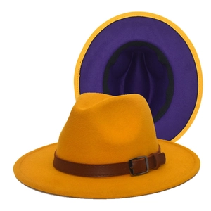 Detail view of yellow felt fedora with purple underbrim and brown leather band