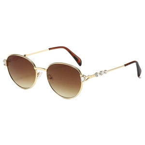 Lunettes de soleil ovales rétro en métal doré avec verres dégradés bruns et cristaux