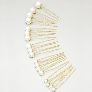 Set of vintage white pearl hair pins with gold U-shaped metal clips for bridal hairstyles