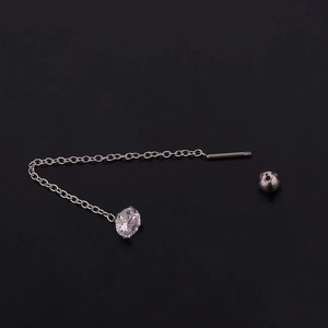 Macro shot of silver stainless steel earring chain with round gemstone and screw back