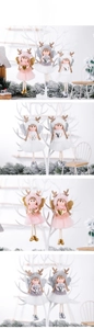 Detail of Christmas angel ornaments with gauze skirts and antler hats in a winter setting