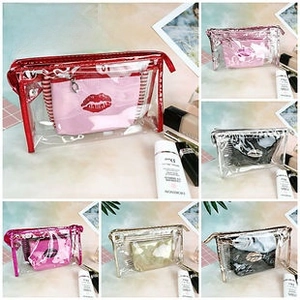 Macro detail of holographic PVC shell cosmetic bag set with zipper and red lip pattern inner