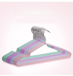 Close-up of non-slip plastic coated hangers in four macaron colors with metal hooks