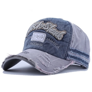 Distressed denim baseball cap with 1969 embroidery and vintage frayed edges