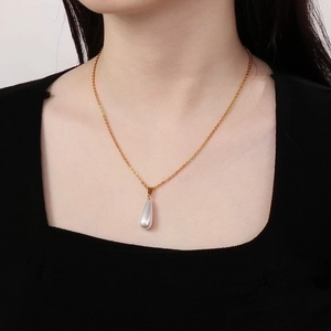 Elegant gold titanium steel necklace featuring a teardrop white pearl pendant for women