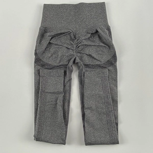 Detail of high waisted seamless yoga leggings with scrunch butt and ribbed texture in grey