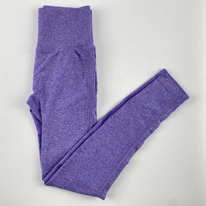 Detailed texture of seamless high-waisted purple yoga leggings with ribbed waistband