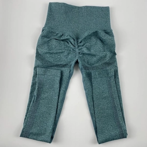 Detail of green marl seamless yoga pants featuring scrunch butt and ribbed texture