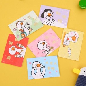 Detailed view of six cartoon duck greeting cards with assorted colors and motivational text