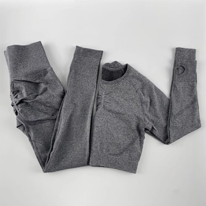 Detail of seamless yoga set showing high waist leggings and long sleeve crop top thumb holes