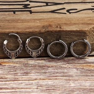 Vintage oxidized silver hoop earrings set with hollow totem and braided metal patterns