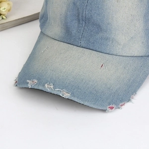 Vintage light blue washed denim baseball cap with distressed brim and retro finish