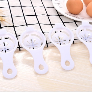 Set of four white plastic egg white separators for baking and kitchen use