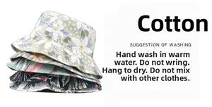 Close-up of stacked floral cotton bucket hats with detailed tropical prints and wide brims