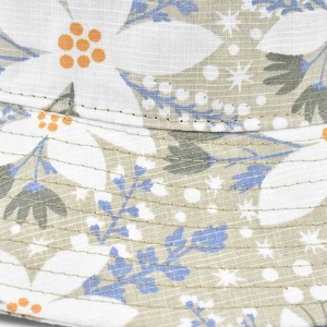 Detailed close-up of stitching and floral fabric texture on the wide brim sun hat