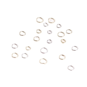 Gold and silver open jump rings for DIY jewelry making on white background