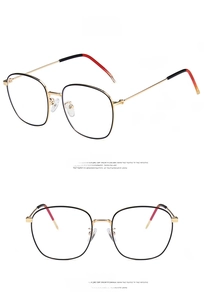 Detail view of retro square metal glasses frames in gold and black with non-slip temple tips