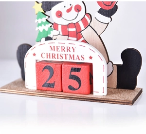 Close-up of wooden Christmas countdown advent calendar with Santa and snowman figures