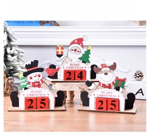 DIY wooden Christmas countdown calendar ornaments featuring Santa, snowman, and reindeer shapes