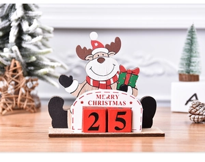 Close-up of wooden reindeer advent calendar with numbered blocks on festive table