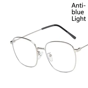 Retro silver metal round eyeglasses frame with anti-blue light lenses in a side view