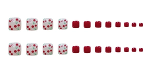 Detail view of 24 pieces set of cherry pattern and solid red press-on toe nails