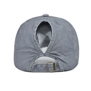 Detail of washed cotton ponytail baseball cap with teardrop opening and metal buckle