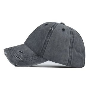Distressed dark gray washed cotton baseball cap with vintage ripped details and curved brim