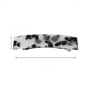 Détails d'une pince à cheveux de 9 cm à motif marbre avec dimensions et poids indiqués