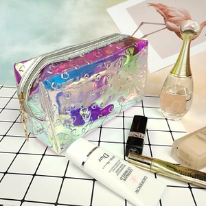 Close-up of holographic laser makeup bag with heart pattern and star-shaped zipper pull