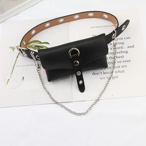 Close-up of black punk belt with silver metal grommets, chains, and matching waist bag pouch
