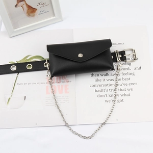Punk style black PU leather waist bag with silver chain and metal eyelet belt on magazine