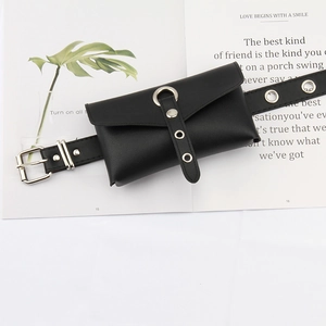 Detail of black leather waist bag with punk style grommet belt and metal buckle decor