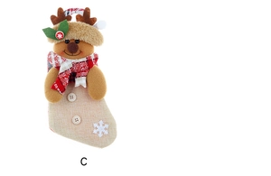 Close-up of reindeer Christmas stocking with brown antlers and red checkered scarf