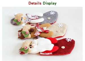 Detail display of small Christmas stockings featuring 3D snowman, reindeer and Santa designs
