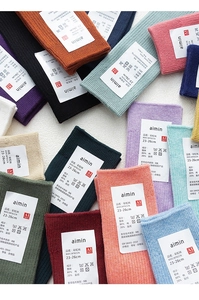 Detailed close-up of colorful ribbed cotton socks with breathable knit texture and labels
