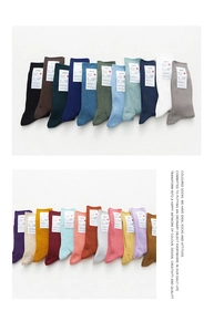 Detailed display of colorful ribbed cotton socks showing variety of vibrant solid hues