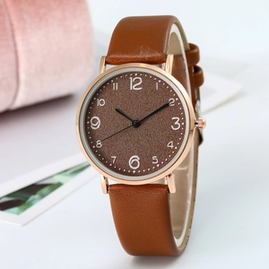 Minimalist ultra-thin rose gold watch with brown leather strap and matte dial for women