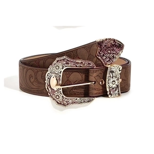 Brown western embossed leather belt with gold floral buckle and engraved metal tips