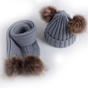 Winter knitted grey beanie and scarf set for children with faux fur double pom poms