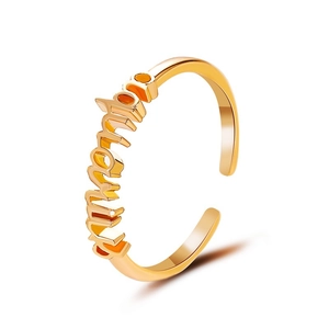 Minimalist gold open ring featuring artistic zodiac lettering in a high-polished finish