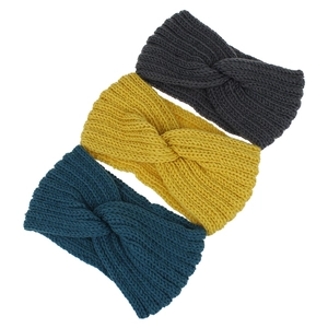 Close-up of knit texture on women's winter headbands in grey, yellow and blue colors
