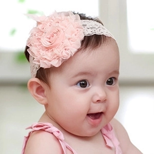 Close-up of pink baby lace headband with large layered mesh flower for photography