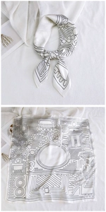 Detail of a square silk scarf with black hand-drawn floral patterns and '31' print on white