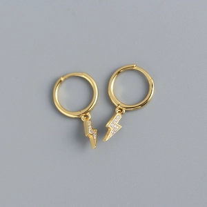 Detail of gold S925 sterling silver hoop earrings with sparkling lightning bolt charms