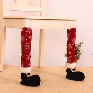 Christmas chair leg covers with red snowflake fabric and black Santa boot design