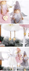Detail of plush Christmas angel dolls with wooden heads and glitter wings in three soft colors