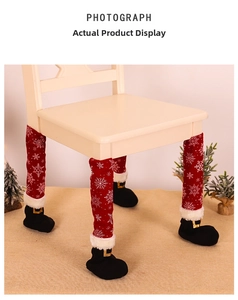 Detail of Christmas chair leg covers with white snowflake patterns and black boot design