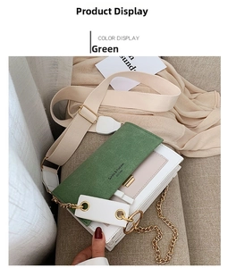 Detail of forest green frosted small square bag with metal chain and contrast leather